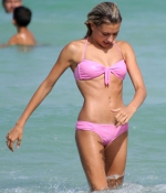 HAILEY-BALDWIN-in-Bikini-at-the-Beach-in-Miami-2015-pink-bikini-1.jpg
