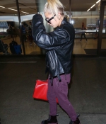 hailey-baldwin-lax-airport-purple-pants-boots-black-leather-jacket-1.jpg