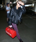 hailey-baldwin-lax-airport-purple-pants-boots-black-leather-jacket-2.jpg