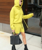 hailey-baldwin-arrives-for-a-meeting-in-new-york-city-yellow-outfit-hoodie-black-ankle-boots1.jpg