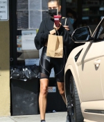 hailey-bieber-rocks-black-bike-shorts-with-matching-crop-top-while-stopping-for-a-healthy-juice-in-west-hollywood-california-0.jpg