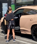 hailey-bieber-rocks-black-bike-shorts-with-matching-crop-top-while-stopping-for-a-healthy-juice-in-west-hollywood-california-12.jpg