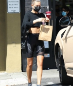 hailey-bieber-rocks-black-bike-shorts-with-matching-crop-top-while-stopping-for-a-healthy-juice-in-west-hollywood-california-4.jpg