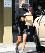hailey-bieber-rocks-black-bike-shorts-with-matching-crop-top-while-stopping-for-a-healthy-juice-in-west-hollywood-california-5.jpg