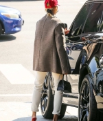 hailey-bieber-style-October-9-Out-in-West-Hollywood-red-sandals-heels-cap-white-jeans-jacket-5.jpg