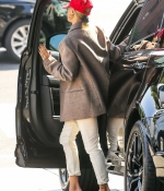 hailey-bieber-style-October-9-Out-in-West-Hollywood-red-sandals-heels-cap-white-jeans-jacket-6.jpg
