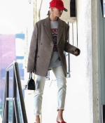 hailey-bieber-style-October-9-Out-in-West-Hollywood-red-sandals-heels-cap-white-jeans-jacket-7.jpg