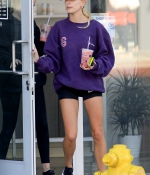 hailey-bieber-november-25-Picks-Up-a-Healthy-Smoothie-in-west-Hollywood-purple-sweatshirt-nike-black-shorts-legs-0.jpg