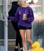 hailey-bieber-november-25-Picks-Up-a-Healthy-Smoothie-in-west-Hollywood-purple-sweatshirt-nike-black-shorts-legs-1.jpg