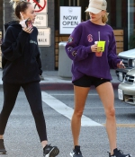 hailey-bieber-november-25-Picks-Up-a-Healthy-Smoothie-in-west-Hollywood-purple-sweatshirt-nike-black-shorts-legs-14.jpg