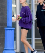 hailey-bieber-november-25-Picks-Up-a-Healthy-Smoothie-in-west-Hollywood-purple-sweatshirt-nike-black-shorts-legs-17.jpg