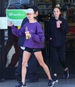 hailey-bieber-november-25-Picks-Up-a-Healthy-Smoothie-in-west-Hollywood-purple-sweatshirt-nike-black-shorts-legs-20.jpg