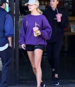 hailey-bieber-november-25-Picks-Up-a-Healthy-Smoothie-in-west-Hollywood-purple-sweatshirt-nike-black-shorts-legs-21.jpg