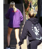 hailey-bieber-november-25-Picks-Up-a-Healthy-Smoothie-in-west-Hollywood-purple-sweatshirt-nike-black-shorts-legs-4.jpg