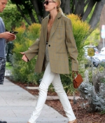 hailey-bieber-looks-stylish-in-green-blazer-and-white-pants-as-she-steps-out-for-coffee-in-west-hollywood-los-angeles-2.jpg