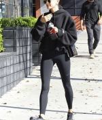 hailey-bieber-shows-off-her-stunning-figure-in-a-black-sports-bra-and-leggings-as-she-hits-a-pilates-session-in-los-angeles-0.jpg