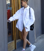 hailey-bieber-puts-on-a-leggy-display-in-denim-cut-offs-and-an-oversized-white-shirt-during-a-spa-visit-in-west-hollywood-california-2.jpg