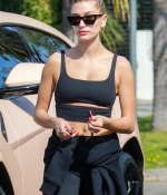 hailey-bieber-sports-a-black-workout-top-and-leggings-during-a-lunch-outing-at-backyard-bowl-in-west-hollywood-california-7.jpg