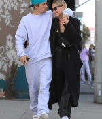 hailey-bieber-and-justin-bieber-share-a-kiss-while-out-for-a-stroll-in-west-hollywood-california-0.jpg