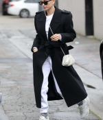 hailey-bieber-braves-the-rain-in-a-black-trench-coat-while-out-for-lunch-in-beverly-hills-california-2.jpg
