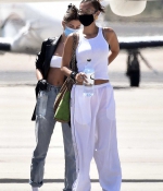 bella-hadid-and-hailey-bieber-arrive-at-the-airport-to-fly-out-on-a-private-jet-after-their-versace-photoshoot-sardinia-italy-1.jpg