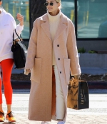 hailey-bieber-wears-a-beige-long-coat-and-nike-air-force-1s-as-she-steps-out-in-los-angeles-0.jpg