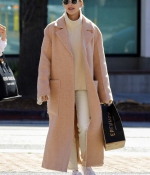 hailey-bieber-wears-a-beige-long-coat-and-nike-air-force-1s-as-she-steps-out-in-los-angeles-1.jpg