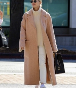 hailey-bieber-wears-a-beige-long-coat-and-nike-air-force-1s-as-she-steps-out-in-los-angeles-2.jpg
