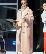 hailey-bieber-wears-a-beige-long-coat-and-nike-air-force-1s-as-she-steps-out-in-los-angeles-4.jpg