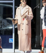 hailey-bieber-wears-a-beige-long-coat-and-nike-air-force-1s-as-she-steps-out-in-los-angeles-5.jpg