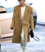 hailey-bieber-wears-an-oversized-beige-coat-as-she-makes-a-visit-to-a-doctors-office-in-beverly-hills-los-angeles-0.jpg