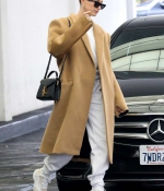 hailey-bieber-wears-an-oversized-beige-coat-as-she-makes-a-visit-to-a-doctors-office-in-beverly-hills-los-angeles-4.jpg