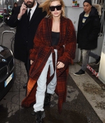 hailey-baldwin-coat-out-and-about-during-milan-fashion-week-in-milan-italy-0.jpg
