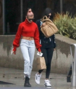 kendall-jenner-and-hailey-baldwin-_January-8-Out-for-Coffee-in-Los-Angeles-red-sweater-adidas-raining-2018-0.jpg