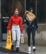 kendall-jenner-and-hailey-baldwin-_January-8-Out-for-Coffee-in-Los-Angeles-red-sweater-adidas-raining-2018-1.jpg