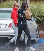 kendall-jenner-and-hailey-baldwin-_January-8-Out-for-Coffee-in-Los-Angeles-red-sweater-adidas-raining-2018-2.jpg