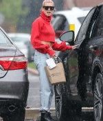 kendall-jenner-and-hailey-baldwin-_January-8-Out-for-Coffee-in-Los-Angeles-red-sweater-adidas-raining-2018-4.jpg