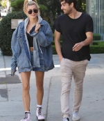 hailey-baldwin-denim-jeans-jacket-shorts-boots-grabs-lunch-with-a-friend-on-melrose-avenue-in-los-angeles-4.jpg