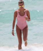 hailey-baldwin-June-10-In-Swimsuit-on-the-Beach-in-Miami-pink-swimswuit-6.jpg